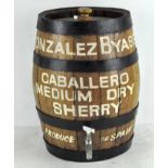 A metal rimmed oak barrel for 'Caballero Medium Dry Sherry' with stopper and a tap to the front,