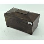 A Victorian oak tea caddy, raised on bun feet with a brass lock,