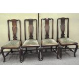 A set of four mahogany dining chairs, on cabriole legs, upholstered in green fabric,
