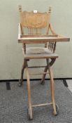 A vintage child's wooden high chair,