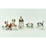 A selection of 19th century ceramic models of dogs, in standing and seated positions,