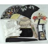 A small collection of ladies accessories, including four contemporary fans,