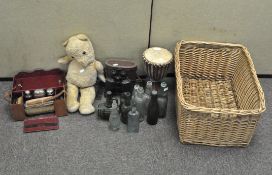 A selection of old glass bottles, a bongo drum, a pair of Bloomed lens binoculars in leather case,