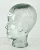 A vintage moulded glass display head, previously used to display glasses,