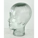 A vintage moulded glass display head, previously used to display glasses,