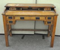 An Arts and Crafts style writing desk,