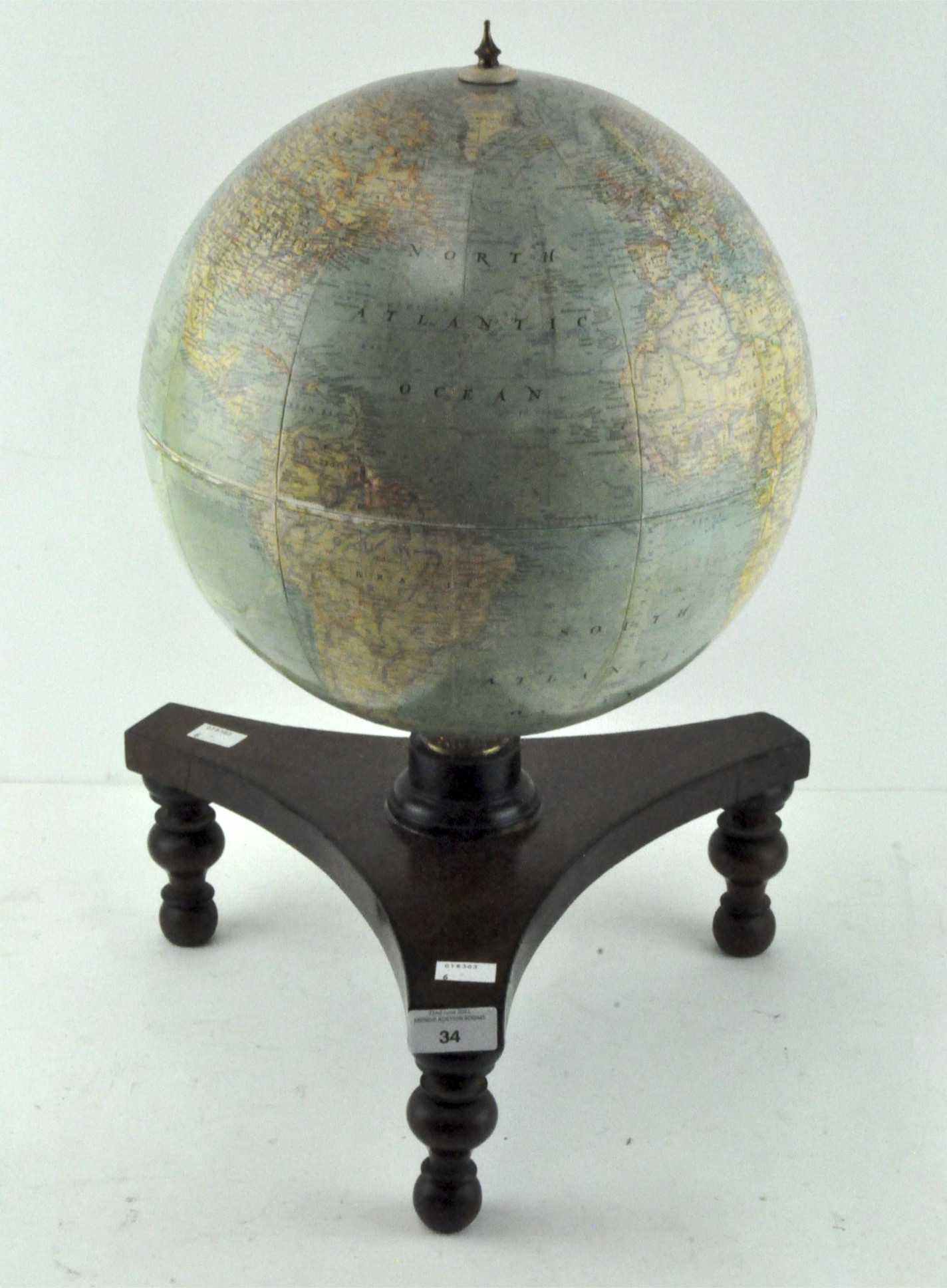 A tabletop terrestrial globe, by Melville Bell, on wooden stand,