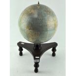 A tabletop terrestrial globe, by Melville Bell, on wooden stand,