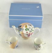 A Wedgwood Butterfly Bloom teapot & cover and two cups,