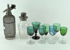 A vintage lattice wrapped glass soda syphon by 'Aerators Ltd London',