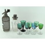 A vintage lattice wrapped glass soda syphon by 'Aerators Ltd London',