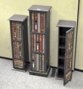 Three modern CD storage units with faux book front,