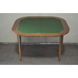 An inlaid mahogany folding card table, raised on tapering supports,