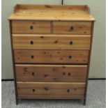 A modern pine chest of drawers, comprising two short over four long drawers,