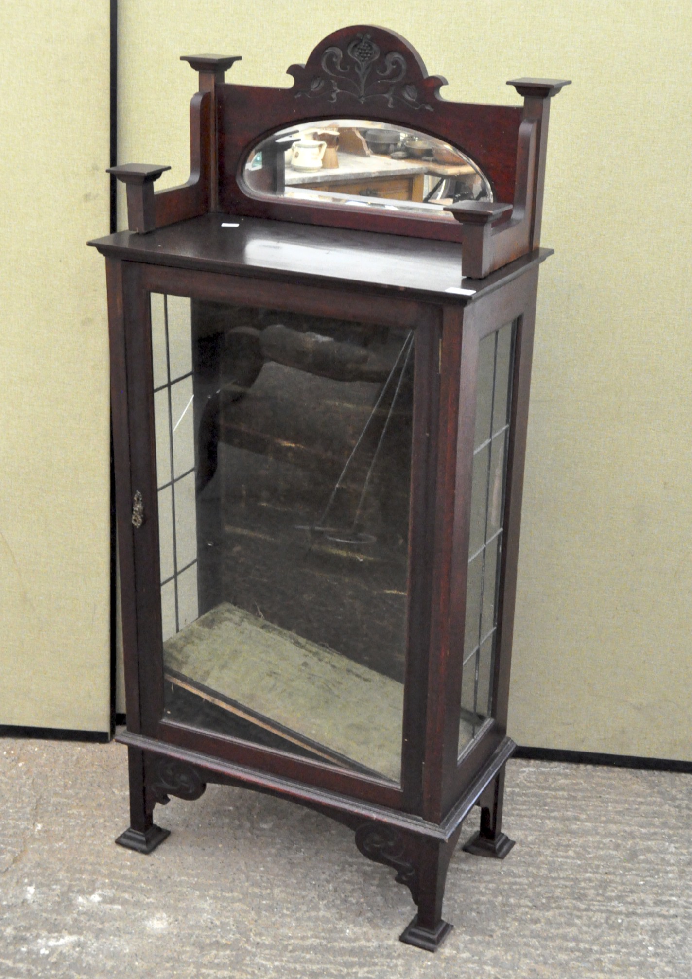 A late 19th/early 20th century mahogany display cabinet, glazed front and sides, with two shelves,