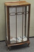 A vintage early 20th century Art Deco walnut single door bow fronted display cabinet