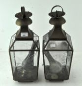 A pair of 20th Century brass hanging lanterns, with engraved glass panels,
