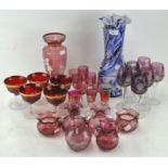 A parcel of coloured glassware including a Mary Gregory style cranberry glass vase,