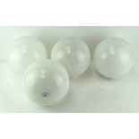 A set of four glass lamp shades, of spherical form,
