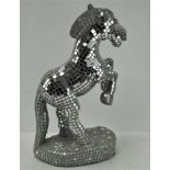 A contemporary mirrored glass model of a prancing horse,