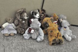 A collection of nine teddy bears, including Charlie bears,