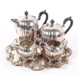 A four piece silver plate tea set and tray, of reeded melon form with scrolling decoration,