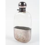 A 20th century glass hip flask with silver cap and detacable cup