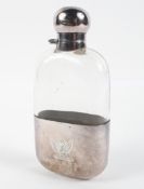 A 20th century glass hip flask with silver cap and detacable cup