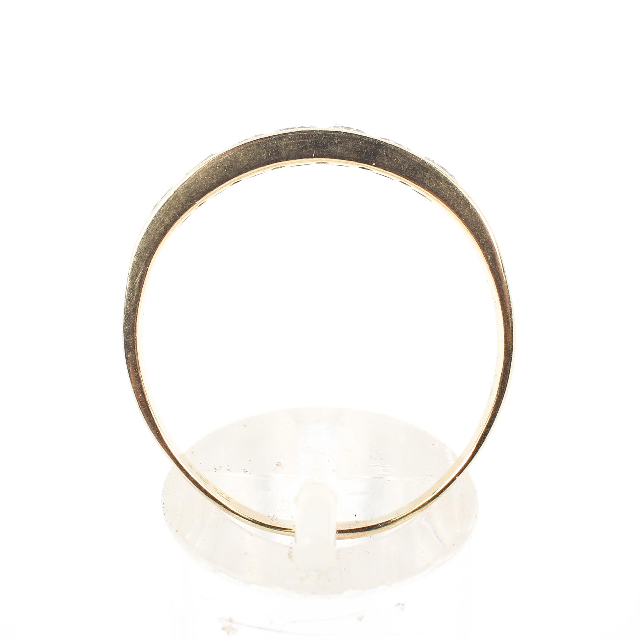 A yellow metal half hoop ring set with seven round brilliant cut diamonds - Image 3 of 4