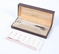 A Dunhill white metal fountain pen,with engine turned decoration,