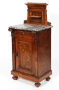 A Victorian marble-topped walnut, mahogany and oak cabinet, carved with acanthus brackets,