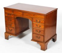 A George III and later mahogany desk,
