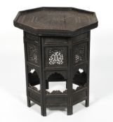 An Anglo-Indian carved hardwood folding table,