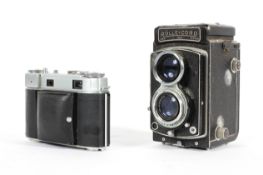 A vintage Rolleicord camera and a Kodak Retina III C camera, in brown leather fitted cases,