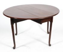 A Queen Anne style oval, mahogany gateleg dining table, on slender legs with raised pad feet,
