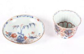 A Chinese Imari tea bowl, possibly late 18th century, of reeded form,