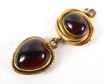 A Victorian gold and garnet mounted two stone pendant,