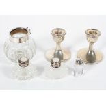 A small collection of silver items to include a pair of desk candlesticks,