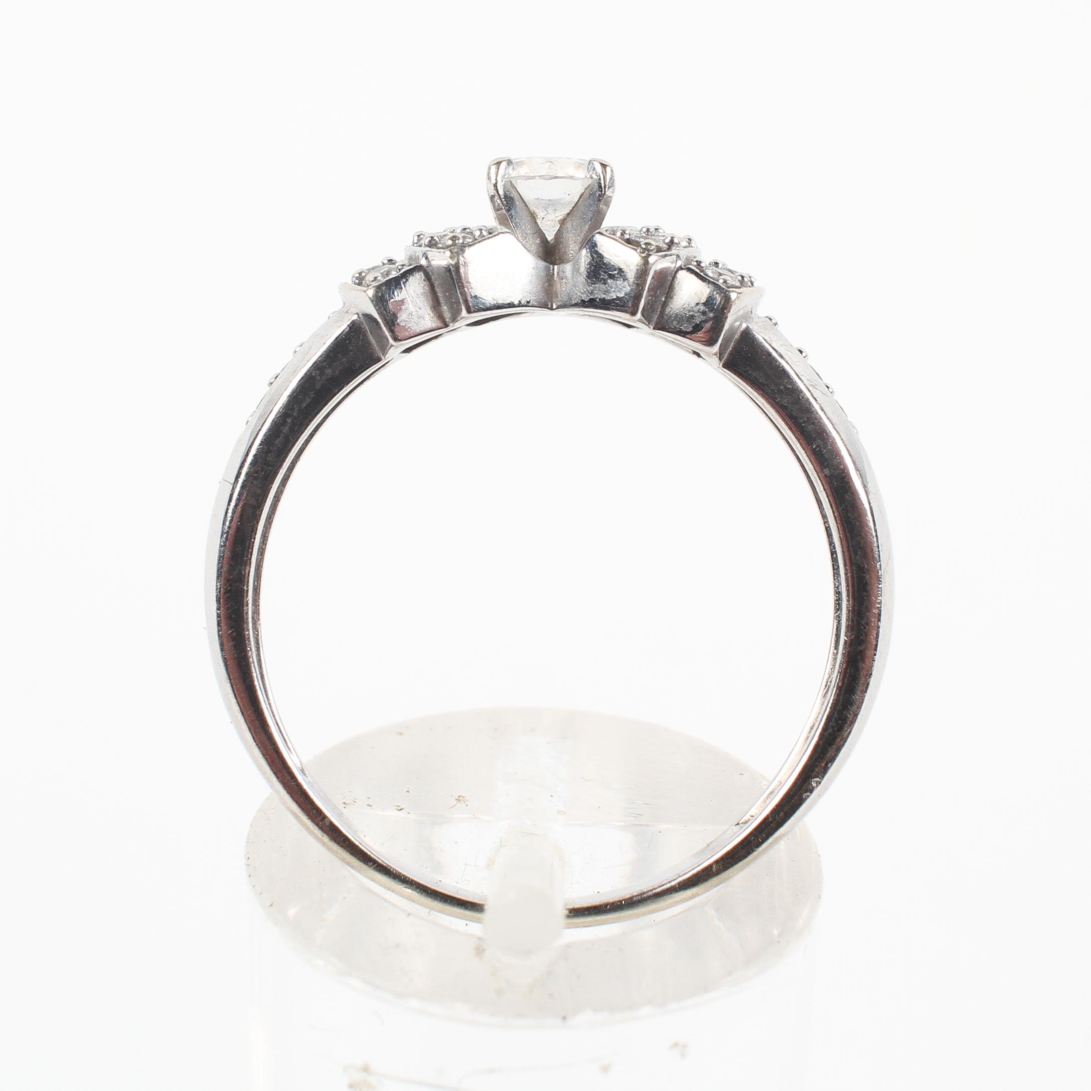 A white metal ring principally set with a round brilliant cut diamond estimated to weigh 0.25cts. - Image 3 of 3