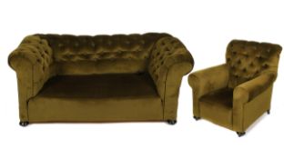A Victorian Chesterfield sofa, with button back and ebonised bun feet,