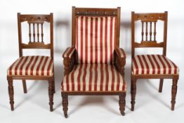 A Victorian oak armchair and a pair of dining chairs,