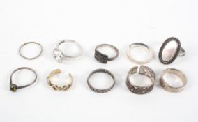 A collection of ten silver rings of variable designs. Size range from K to P Gross weight: 25.