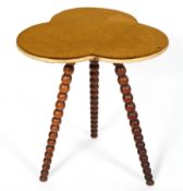 A Victorian occasional table, of three leaf clover form on bobbin turned legs,