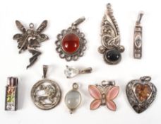 A collection of ten silver pendants of variable designs. Gross weight: 18.