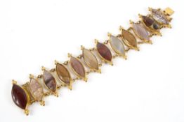 A Victorian gilt metal mounted bracelet, with twelve navette shaped agates and other hardstones,