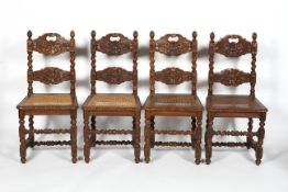 A set of four 19th century Continental oak chairs with carved backs,