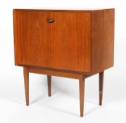 A vintage teak side cabinet, with fall front and fitted interior,