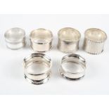 A selection of six assorted silver and white metal napkin rings,