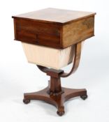 A Victorian mahogany and rosewood work table, the hinged cover above a drawer and silk lined well,