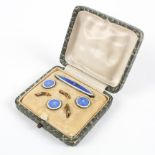 An enamelled shirt button and pin set in original fitted case. Tests indicate silver. 7.0 grams